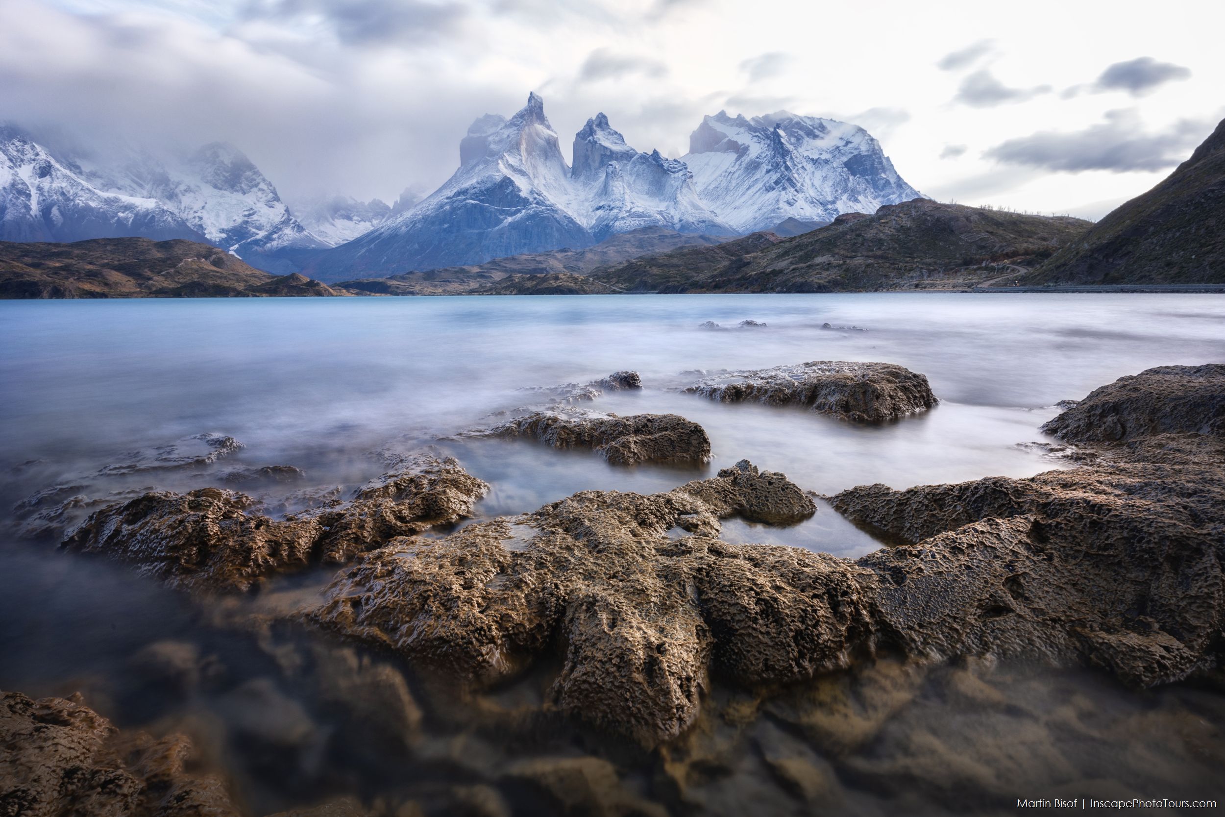 Glacier in Patagonia, Argentina with a boat on the water